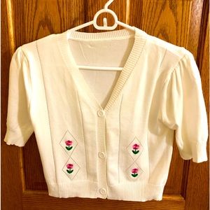 Women’s Short Sleeve Button-Down Sweater with Floral Appliqué. White.